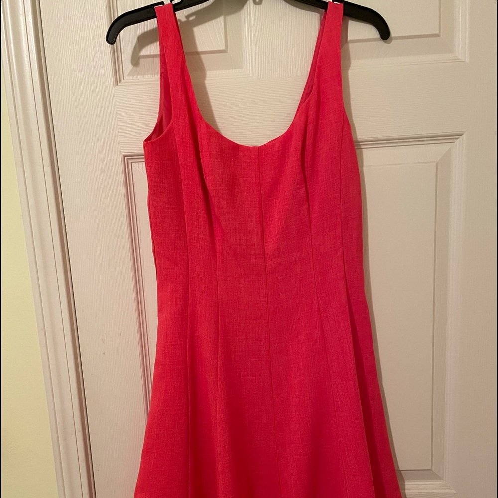 Sundress….bright coral color..  Comes with straw belt .